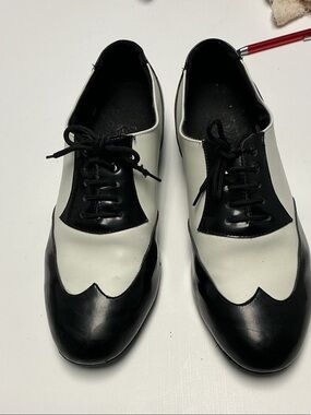 Two-tone dance shoes, look for scuff marks, and breaks in leather